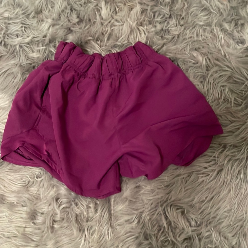 Purple athletic shorts with pockets